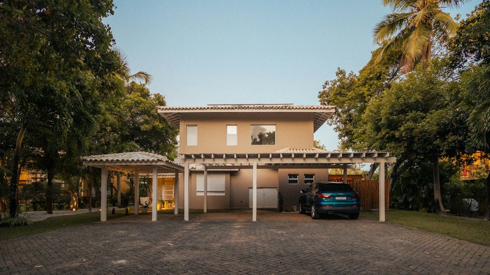 Contemporary house with carport and landscaped entrance